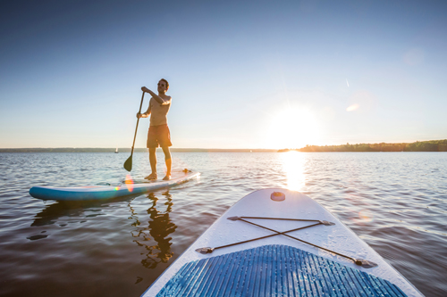 Man stand up paddle boarding off Lopud, Croatia
